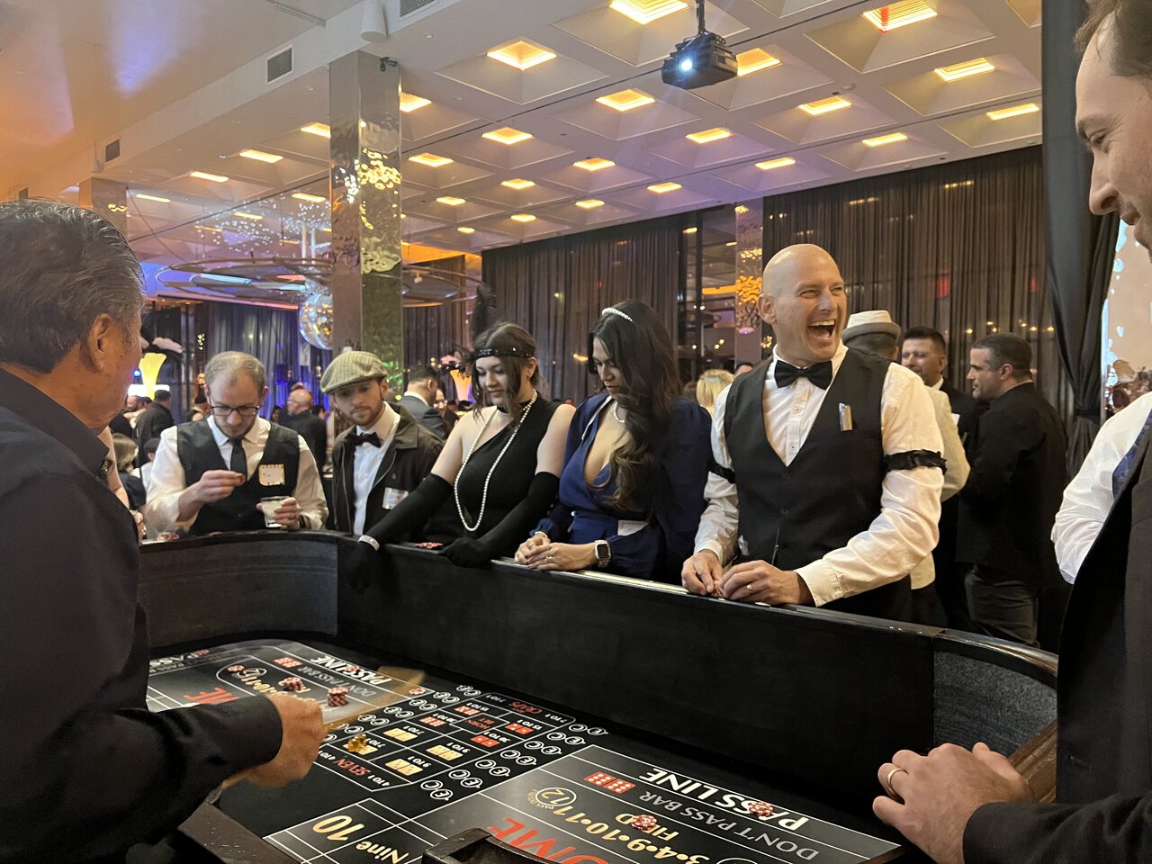 Professional dealers running a roulette table at a Utah casino party