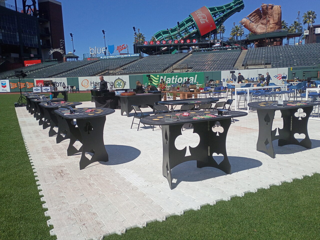 Custom spade and club casino tables set up at a Utah gala venue