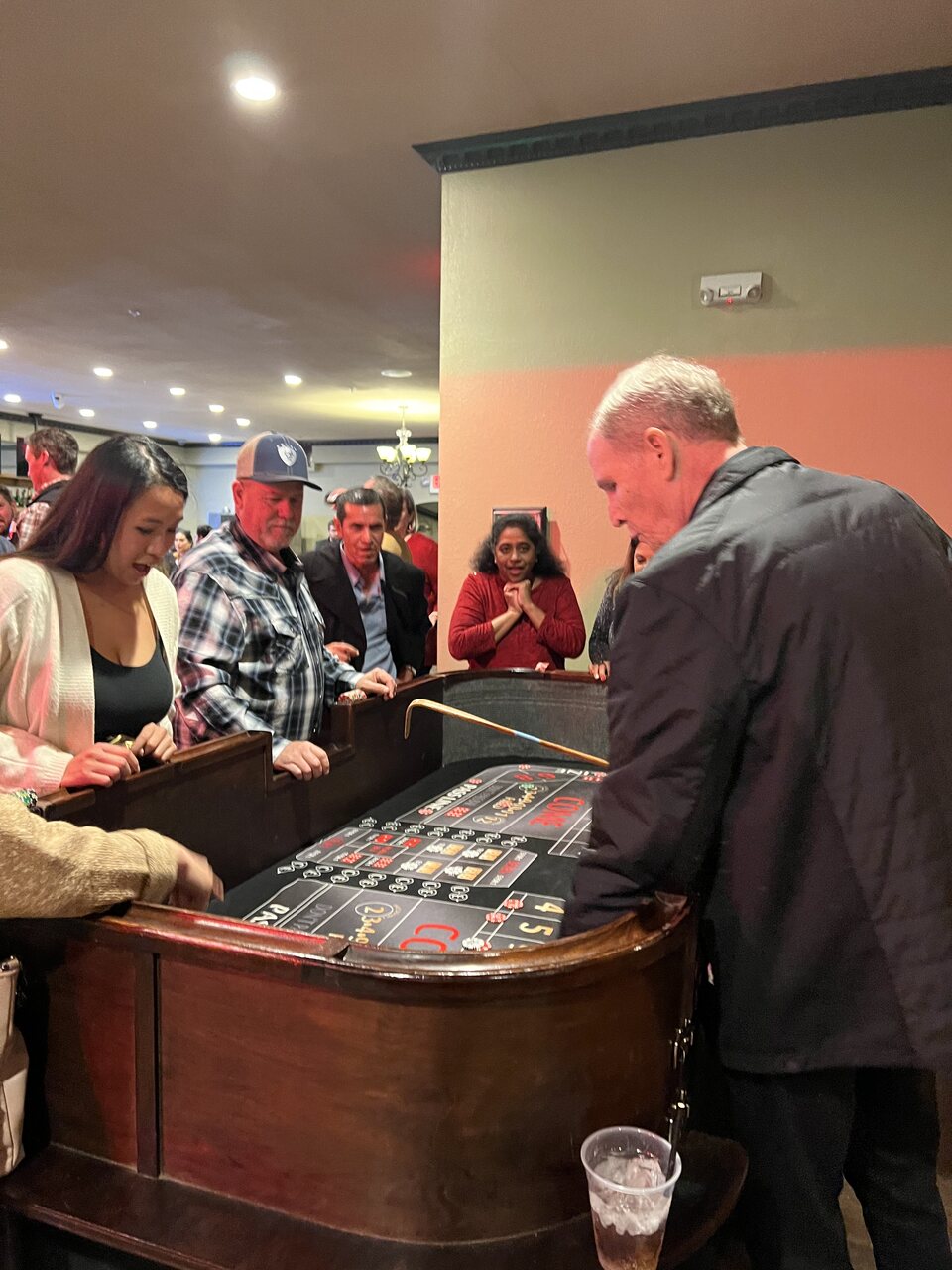 Guests gathered around the roulette wheel at a Salt Lake City casino party