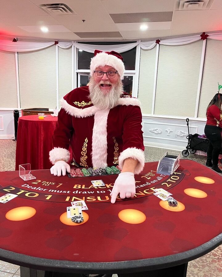 Santa dealing blackjack at a festive holiday casino party in Salt Lake City