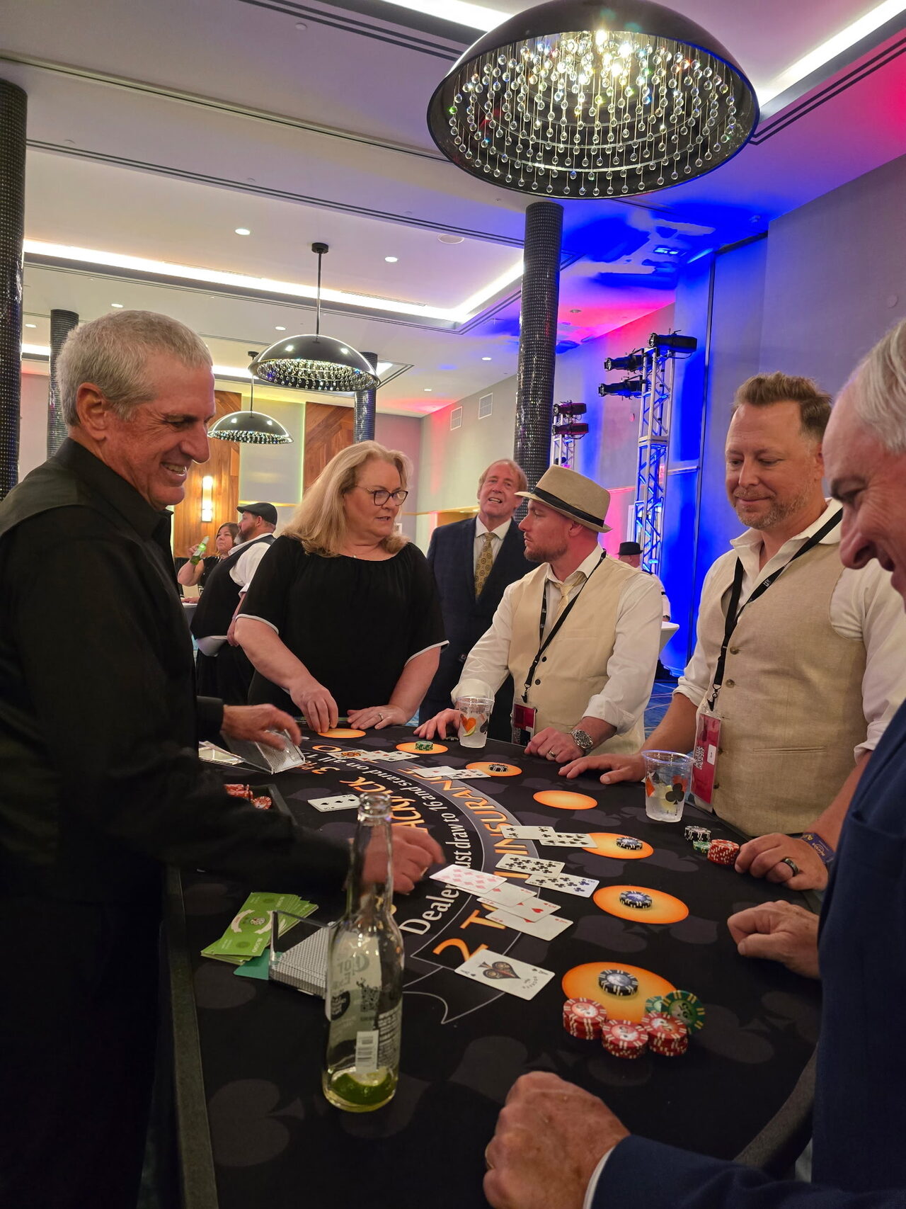 Guests playing blackjack at a Salt Lake City hotel ballroom casino party