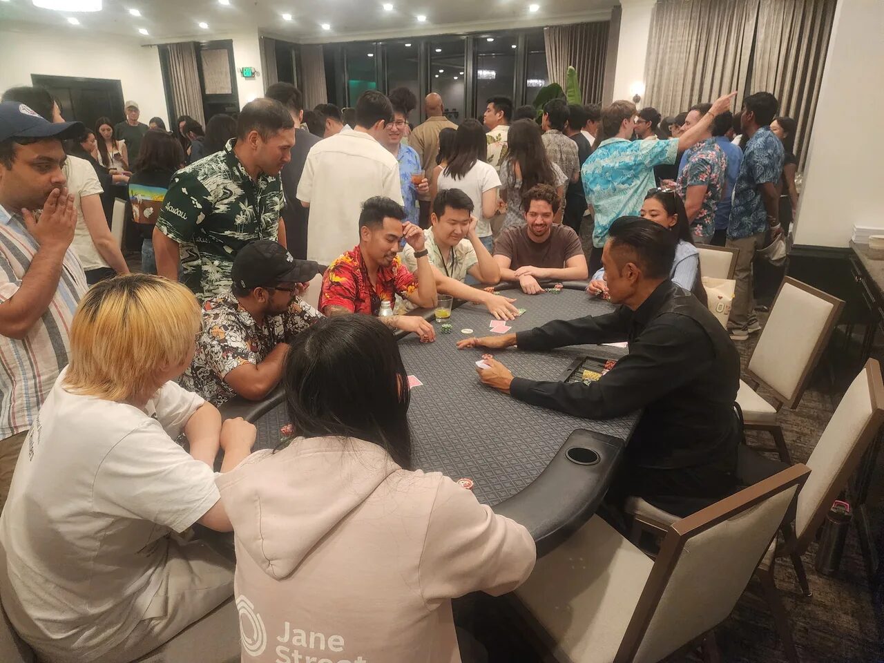 Players at a Texas Hold'em poker table during a Salt Lake City casino night